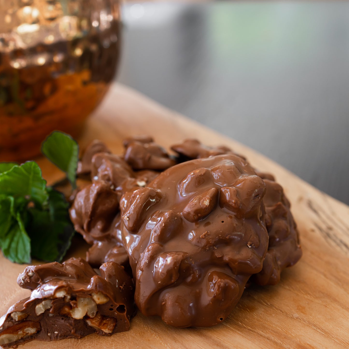 Ellis Bros Pecans Milk Chocolate Pecan Clusters on wooden board