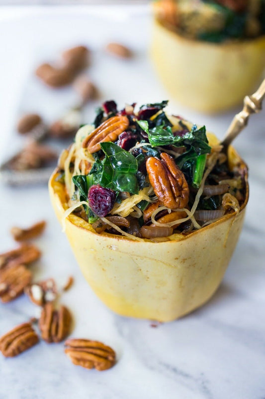 Stuffed Spaghetti Squash with Pecans, Kale and Dried Cranberries 🌱