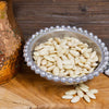 Whole blanched almonds in beaded pewter bowl