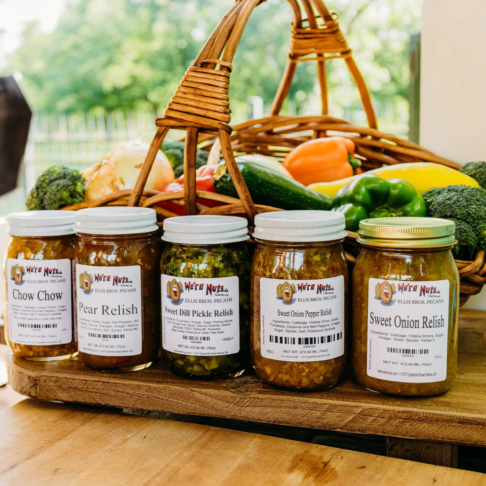 Ellis Bros Pecans chow chow pear relish sweet dill pickle relish sweet onion pepper relish and sweet onion relish in front of vegetable basket