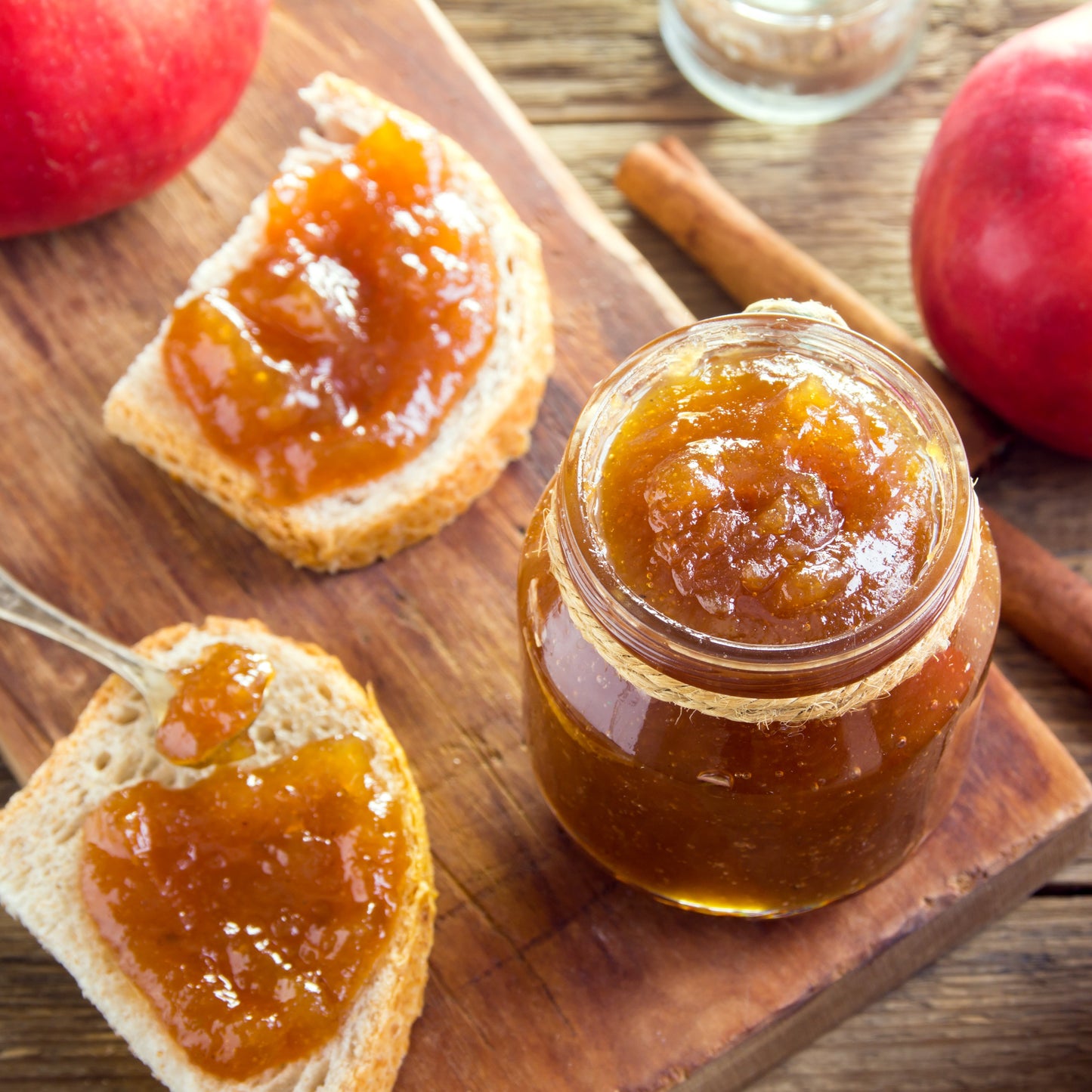 apple butter in glass jar and spread on toast
